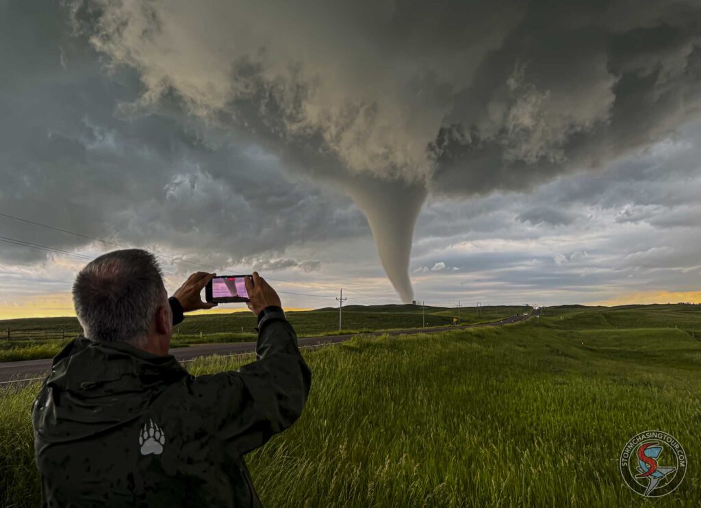 A tour guest recording a tornado developing to the West.
